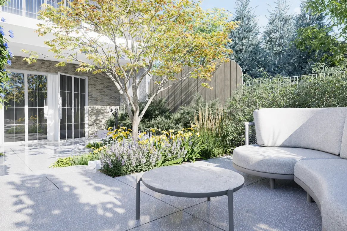 Strefę relaksacyjną oddziela od domu rabata bylinowa wraz ażurowym klonem palmowym i trzcinnikami.