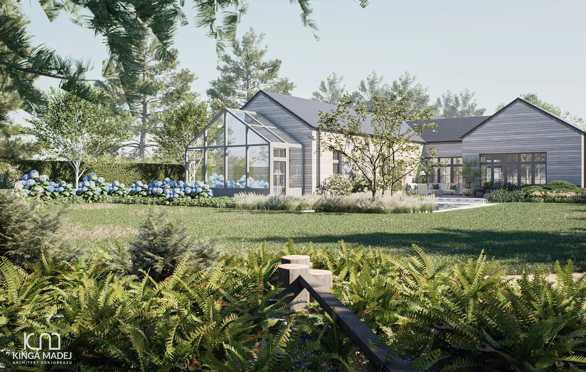 Widok na tył ogrodu z ogrodem zimowym