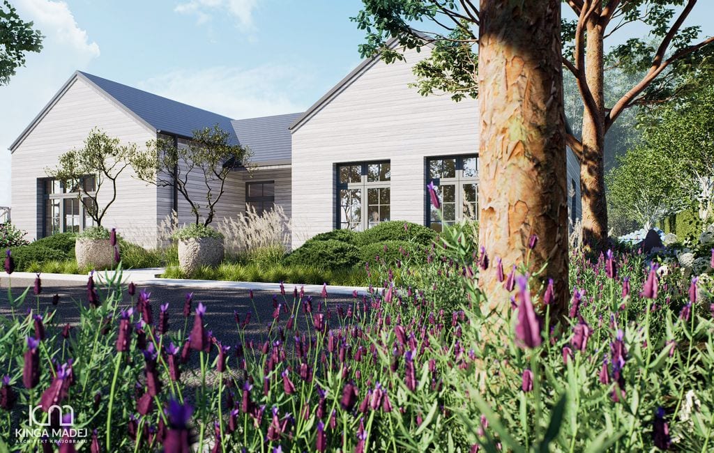 Widok na front domu, drzewa wielopienne w kamiennych donicach